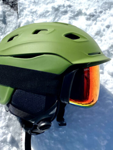 This photo shows the Smith Vantage MIPS Helmet with Smith 4D MAG Goggles outside on snow.