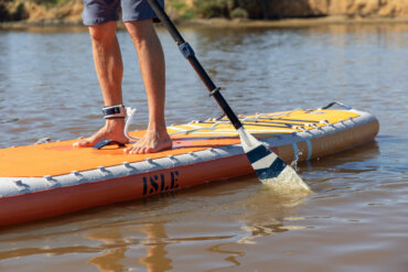 This photo shows a man on a new ISLE Pioneer Pro iSUP.