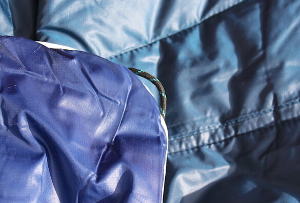 This photo shows the durable corner loops built into the Rumpl's outdoor blankets.
