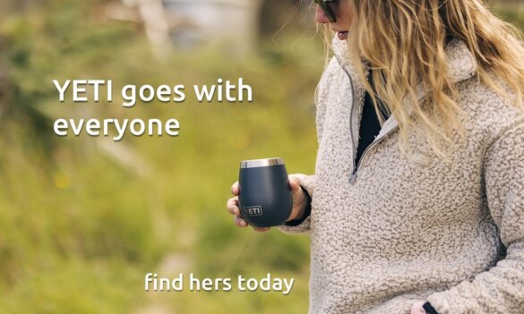 This outdoor gift idea photo shows a woman holding a YETI wine tumbler outside.