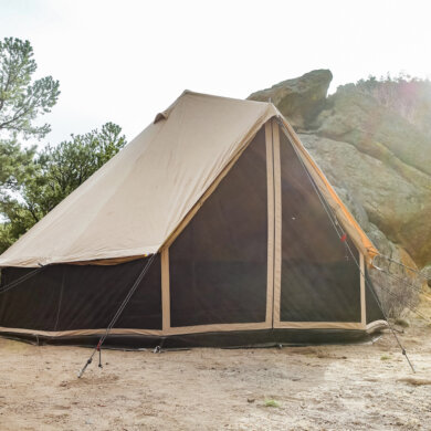 This photo shows the White Duck Regatta 360 Tent set up in a camping environment.