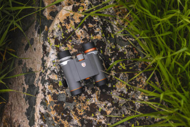 This photo shows the new Maven B.7 Binocular on a rock outside.