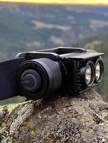 This review photo shows the PEAX Backcountry Duo Headlamp outside on a rock after testing on a pre-dawn hunt.
