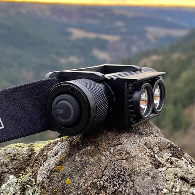 This review photo shows the PEAX Backcountry Duo Headlamp outside on a rock after testing on a pre-dawn hunt.