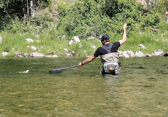 This photo shows the author fly fishing while wearing the Grundéns Boundary Stockingfoot Waders during the testing and review process on an Idaho river.