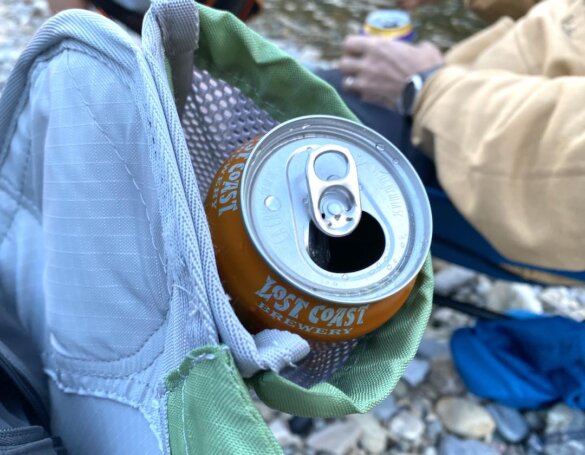 This photo shows a closeup of the Cascade Mountain Tech Hammock Chair cup holder with a beverage can in it.