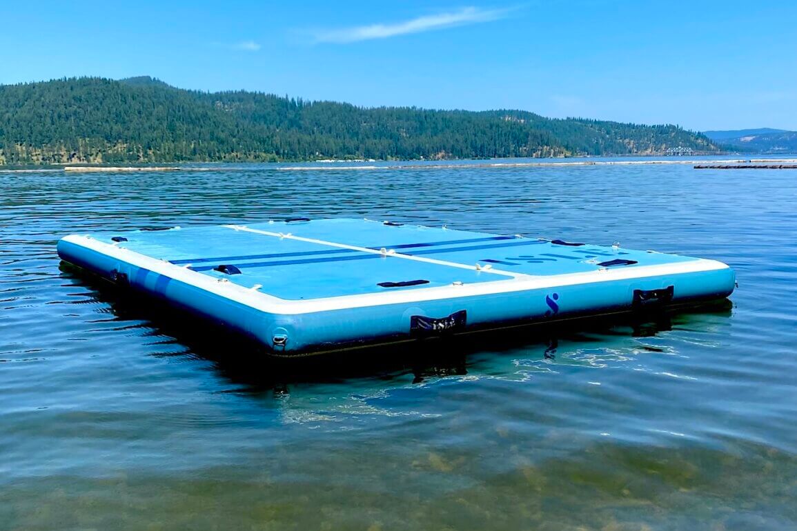This photo shows the ISLE Base Camp Dock inflated and floating on a lake during the testing and review process.