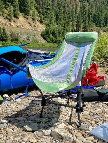 This review photo shows the Cascade Mountain Tech Hammock Chair on a river bank camping area during the testing and review process.