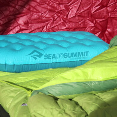 This review photo shows the Sea to Summit Ultralight Deluxe Pillow with a sleeping bag in a tent.