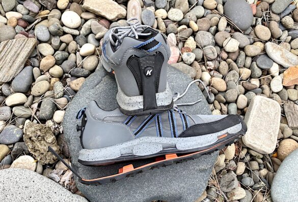 This review photo shows the OmniTrax sole partially removed from a pair of Korkers All Axis Shoes for wet wading.