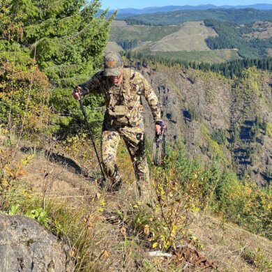 This photo shows the author wearing the Sitka Core Merino 120 LS Crew base layer shirt as his exterior layer during an archery elk hunt in Idaho on a mountainside during the testing and evaluation process.
