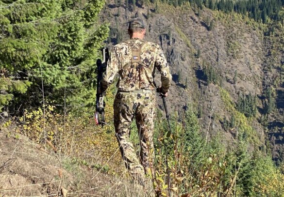 This photo shows the author wearing the Sitka Core Merino 120 LS Crew base layer on a warm sunny day in the mountains during an elk hunting trip.