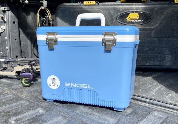 This review photo shows a closed Engel Drybox Cooler on the tailgate of a pickup truck.