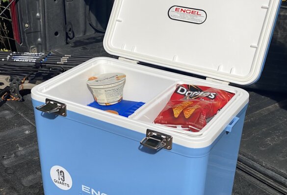 This review photo shows the Engel Drybox Cooler with the lid open and being tested as a drink and lunch cooler during a hunting trip.