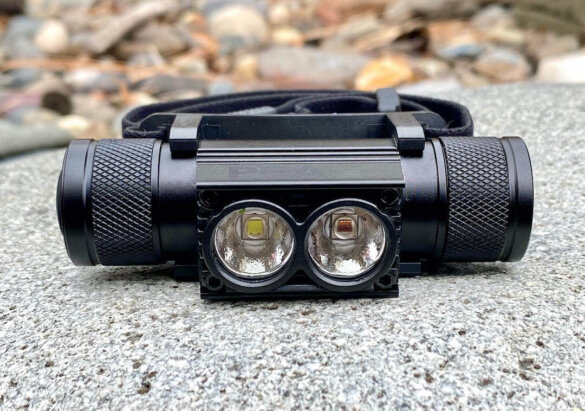 This bowhunter gifts photo shows the PEAX Backcountry Duo Headlamp on a rock.