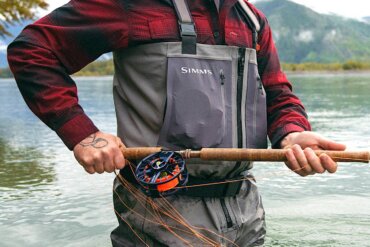 This photo shows a fly fisherman wearing the Simms G4Z Stockingfoot Waders.