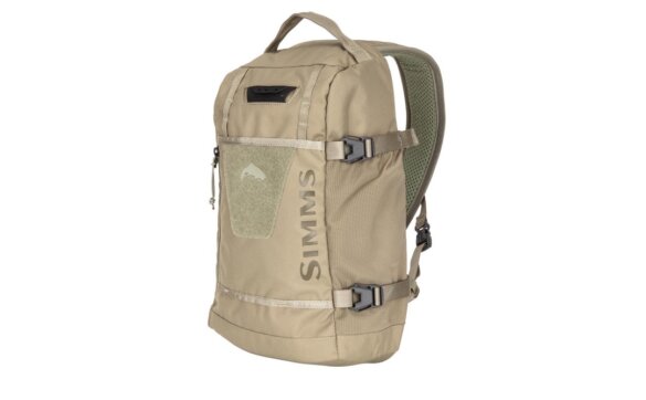 This photo shows the closeout version of the Simms Tributary Sling Pack.