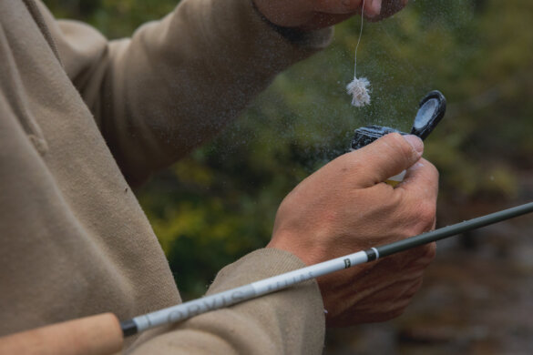 This photo shows a fly fisher holding the new Orvis Helios F fly rod.