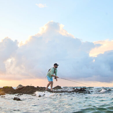 This photo shows a fly fisherman fishing in the ocean with a new Orvis Helios Fly Rod.