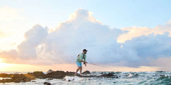 This photo shows a fly fisherman fishing in the ocean with a new Orvis Helios Fly Rod.