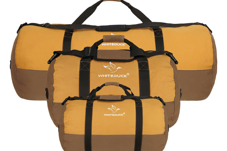 This photo shows the three sizes of the new White Duck Outdoors Filios Canvas Duffel Bags.