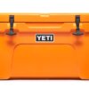 This product photo shows the YETI Tundra 45 Hard Cooler in the King Crab Orange color option.