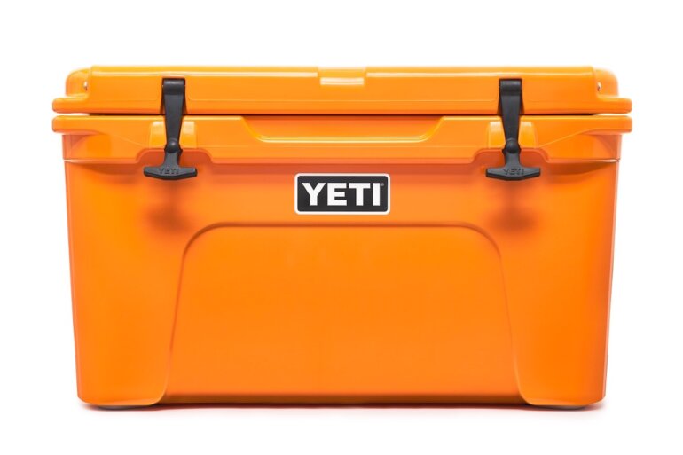 This product photo shows the YETI Tundra 45 Hard Cooler in the King Crab Orange color option.