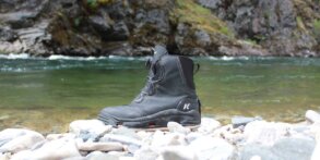 This field-tested review photo shows the Korkers Devil's Canyon Wading Boots near a river.