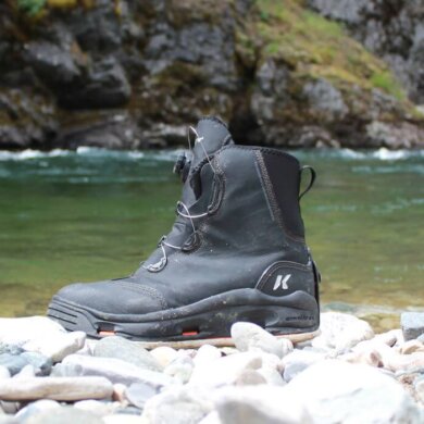 This field-tested review photo shows the Korkers Devil's Canyon Wading Boots near a river.
