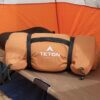 This photo shows the Teton Sports Adventurer Camp Cot Sleeping Pad rolled up on a camping cot inside of a tent during the testing and review process.