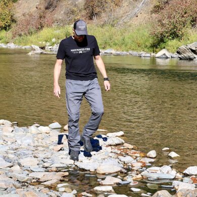 This photo shows the author wearing the Vertx Cutback Technical Pants during near a river during the testing and review process.