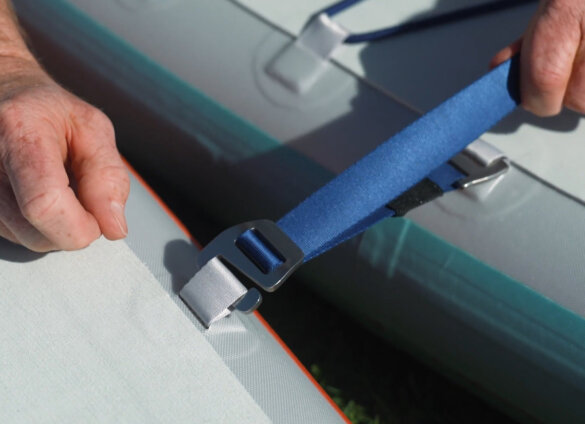 ISLE Link System closeup with strap connected to links between two paddle boards.