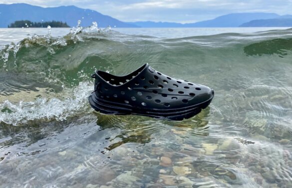 Kane Revive shoes floating on water in a lake near a wave.