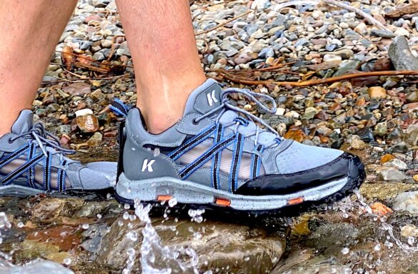Korkers All Access Shoe worn by author on shoreline at edge of water.