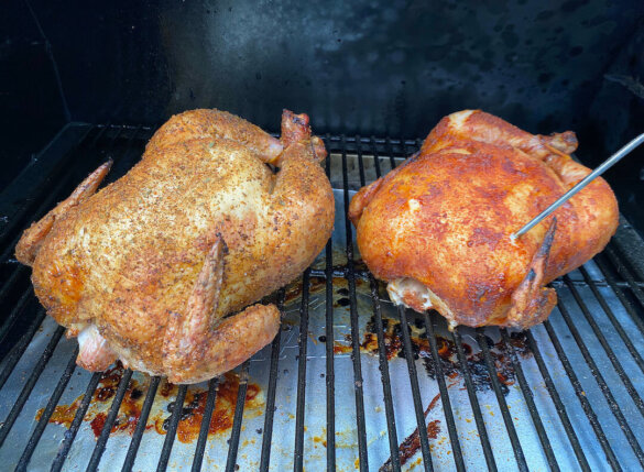 Two roasted chickens on a Traeger Pro 575 Pellet Grill.