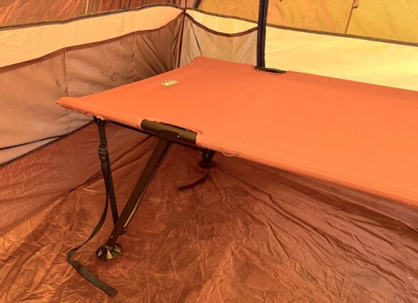 Head portion of the Campwell Folding Cot setup inside a tent.