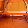 REI Co-op Campwell Folding Cot set up inside of a camping tent.