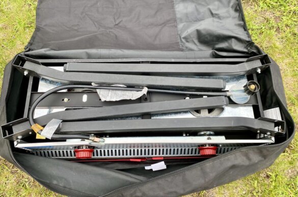 Camp Chef Pro series 14 stove folded up and packed into a carry bag accessory.
