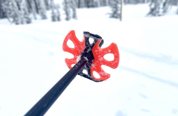 Closeup of the Leki Helicon snow baskets outside during the author's testing process while skiing.