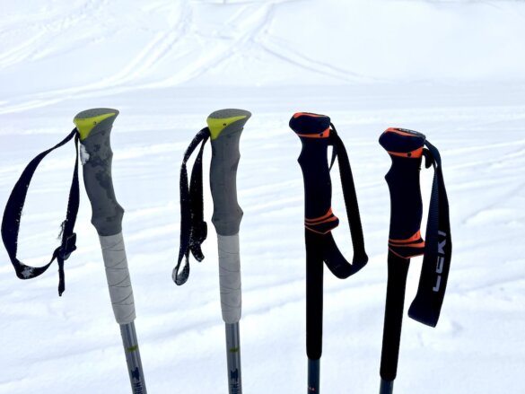 Handles and straps on Mountainsmith Glissade Ski Poles next to Leki Helicon Lite handles.