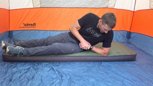 Author Chris Maxcer illustrates the amazing side stability on the Exped MegaMat air mattress.