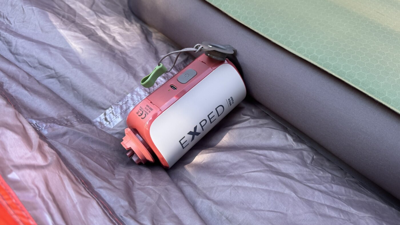 exped mega pump shown inflating a megamat air mattress inside of a camping tent