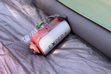 exped mega pump shown inflating a megamat air mattress inside of a camping tent