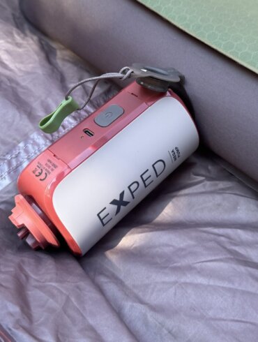 exped mega pump shown inflating a megamat air mattress inside of a camping tent