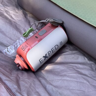exped mega pump shown inflating a megamat air mattress inside of a camping tent
