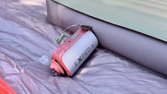 Exped Mega Pump inflating MegaMat inside a tent.