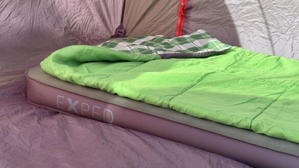 Exped MegaMat LXW version in tent with sleeping bag on top.