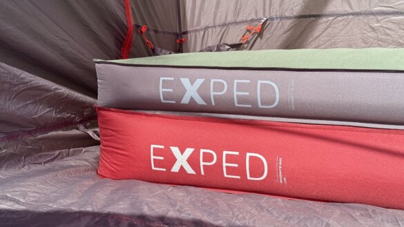 Comparison of Exped MegaMat inflated on top of inflated MegaMat Max version in a tent.