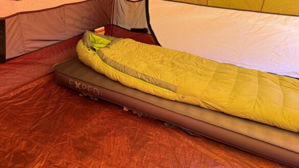 Slick sleeping bag on inflated MegaMat inside tent.