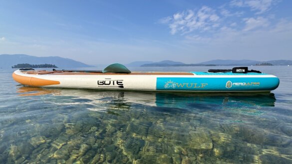 Side profile view of BOTE WULF Aero while floating on a lake.